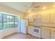 View of the kitchen featuring nice white cabinets and appliances at 901 Illinois Ave, St Cloud, FL 34769