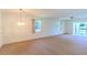 Open living room with lots of natural light at 901 Illinois Ave, St Cloud, FL 34769