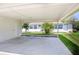 View of the concrete parking area with the lawn at 901 Illinois Ave, St Cloud, FL 34769