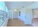 Bright sunroom with plenty of windows, closet, and door to the outside at 901 Illinois Ave, St Cloud, FL 34769
