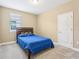 Cozy bedroom with a comfortable bed and ample natural light at 9207 Busaco Park Way, Winter Garden, FL 34787