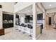Bright kitchen island with pendant lights, dark cabinetry, and stainless steel appliances at 9207 Busaco Park Way, Winter Garden, FL 34787