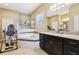 Inviting main bathroom featuring a soaking tub with mosaic tile accents, walk-in shower, and granite countertops at 9207 Busaco Park Way, Winter Garden, FL 34787