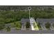 Aerial view of townhome with a well-manicured lawn, landscaping, and close proximity to wooded area at 976 Rock Harbor Ave, Orlando, FL 32828