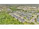 Aerial view of gray townhomes near lakes and a wooded area at 976 Rock Harbor Ave, Orlando, FL 32828