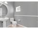 Half bathroom with stylish pedestal sink and neutral decor at 976 Rock Harbor Ave, Orlando, FL 32828