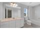 Bathroom with a large vanity, mirror and combination bathtub and shower at 976 Rock Harbor Ave, Orlando, FL 32828
