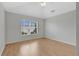 Bedroom with hard floors, neutral paint, and window with blinds at 976 Rock Harbor Ave, Orlando, FL 32828