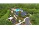Overhead shot of community center, playground, pool, and parking lot amid trees and landscaping at 976 Rock Harbor Ave, Orlando, FL 32828