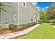 Well-maintained townhome exterior with lush landscaping at 976 Rock Harbor Ave, Orlando, FL 32828