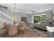 Bright living room featuring a modern fireplace, hardwood floors, and access to outdoor patio at 976 Rock Harbor Ave, Orlando, FL 32828