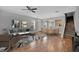 Well-lit living space with hardwood floors and open access to the kitchen and dining area at 976 Rock Harbor Ave, Orlando, FL 32828