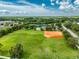 Aerial view of community park with baseball field, green space and amenities at 9966 Hidden Dunes Ln, Orlando, FL 32832