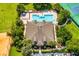 Aerial view showing community amenities: pool, clubhouse, and sports facilities at 9966 Hidden Dunes Ln, Orlando, FL 32832
