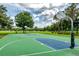 Community basketball court with trees in background at 9966 Hidden Dunes Ln, Orlando, FL 32832