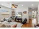 Bedroom with ceiling fan, light walls, entertainment center, and window at 9966 Hidden Dunes Ln, Orlando, FL 32832