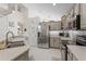 Modern kitchen featuring stainless steel appliances, countertops and ample cabinet space at 9966 Hidden Dunes Ln, Orlando, FL 32832