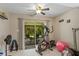 This room is currently being used as an exercise area and exits to the backyard and patio at 9966 Hidden Dunes Ln, Orlando, FL 32832