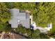 Aerial view of the home showcasing the backyard pool and manicured landscaping at 1011 Lake Davis Dr, Orlando, FL 32806