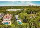Beautiful home with a pool and stunning lake views from this aerial perspective at 1011 Lake Davis Dr, Orlando, FL 32806