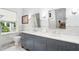 Elegant bathroom with double vanities, marble countertops, and contemporary fixtures at 1011 Lake Davis Dr, Orlando, FL 32806