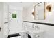 Stylish bathroom featuring glass shower, white tile, and elegant fixtures at 1011 Lake Davis Dr, Orlando, FL 32806