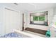 Charming bedroom featuring a cozy reading nook with built-in bookshelves and plush cushions at 1011 Lake Davis Dr, Orlando, FL 32806
