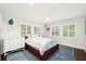 Serene bedroom with neutral tones, large windows, and hardwood floors create a relaxing space at 1011 Lake Davis Dr, Orlando, FL 32806