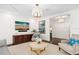 Elegant living space with modern furniture, dark wood floors, and recessed lights, creating a sophisticated look at 1011 Lake Davis Dr, Orlando, FL 32806