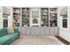 Cozy reading nook with built-in bookshelves, a comfortable couch, and lots of natural light at 1011 Lake Davis Dr, Orlando, FL 32806