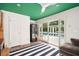 Indoor living area with floor-to-ceiling sliding doors facing a pool at 1011 Lake Davis Dr, Orlando, FL 32806
