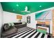 Stylish living room featuring white walls, a green ceiling and a striped rug at 1011 Lake Davis Dr, Orlando, FL 32806