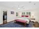 A bright main bedroom with hardwood floors and a walk-in closet for ample storage at 1011 Lake Davis Dr, Orlando, FL 32806
