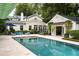 Inviting pool area with guesthouse, landscaping, and lounging area at 1011 Lake Davis Dr, Orlando, FL 32806