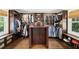 A well-organized walk-in closet with custom shelving, drawers, and hanging rods at 1011 Lake Davis Dr, Orlando, FL 32806