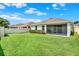 Spacious backyard with a well-maintained lawn and white privacy fence at 1061 Castlevecchio Loop, Orlando, FL 32825