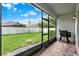 View of screened in patio with a view of the fenced backyard at 1061 Castlevecchio Loop, Orlando, FL 32825