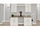 Charming bar area with white cabinets, granite countertop and wine rack at 1061 Castlevecchio Loop, Orlando, FL 32825