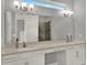 Bathroom featuring double sinks, a large mirror and neutral colors at 1061 Castlevecchio Loop, Orlando, FL 32825