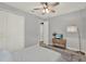 This light-filled bedroom offers ample storage with a closet and cozy interior design at 1061 Castlevecchio Loop, Orlando, FL 32825