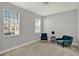 Neutral bedroom featuring a chair by the window with natural light, plush carpet, and fresh paint at 1061 Castlevecchio Loop, Orlando, FL 32825