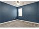 Bedroom showcasing carpeted floors, neutral colors, and a window providing natural light at 1061 Castlevecchio Loop, Orlando, FL 32825