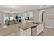 Spacious kitchen with granite countertops, stainless steel appliances, and a clear view to the open living area at 1061 Castlevecchio Loop, Orlando, FL 32825