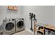 Well-equipped laundry room with side-by-side washer and dryer and storage solutions at 1061 Castlevecchio Loop, Orlando, FL 32825