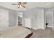 Serene main bedroom with neutral color scheme and ensuite bathroom at 1061 Castlevecchio Loop, Orlando, FL 32825