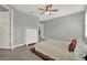 Serene main bedroom with neutral color scheme and a white dresser at 1061 Castlevecchio Loop, Orlando, FL 32825