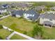 Aerial view of a beautiful home with a spacious backyard, a screened-in porch, and white picket fence at 10640 Tibbett St, Orlando, FL 32832
