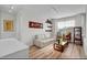 Stylish living room with hardwood floors, a white sofa, and bright natural light from large window at 10640 Tibbett St, Orlando, FL 32832