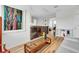 Bright living space featuring hardwood floors, a white sofa, and decorative furnishings at 10640 Tibbett St, Orlando, FL 32832