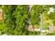 Aerial view of the property showcasing its location nestled among lush greenery at 109 Poinciana Ln, Deltona, FL 32738